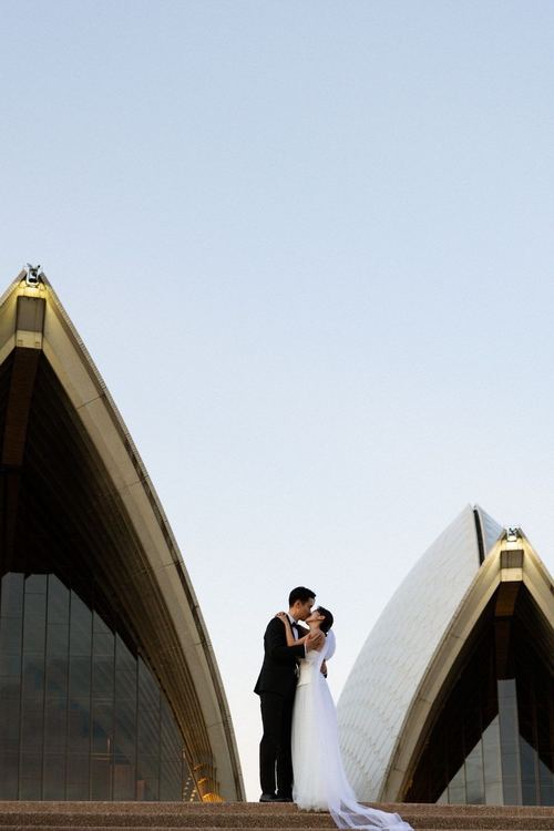 Frank and Seoyun on the Opera House steps at dusk