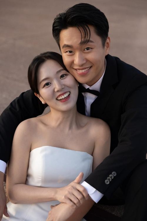 Close portrait of Frank and Seoyun smiling cheek to cheek